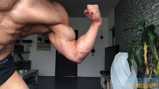 bodybuilder's close-up flexing