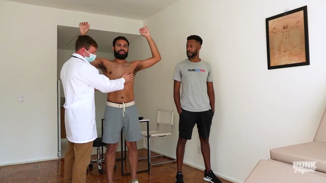 Two young men examined by doctor at the same time