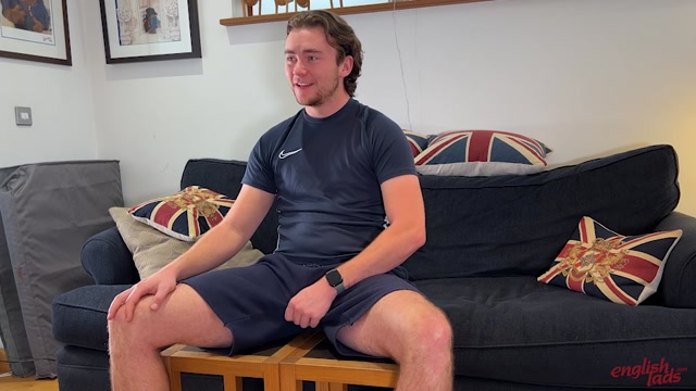 sexy british footballer in shorts gropes his bulge