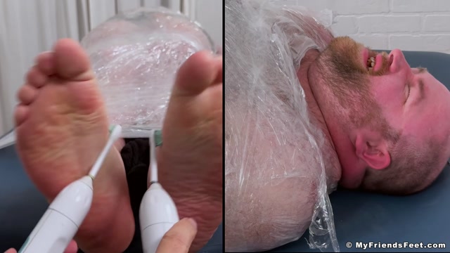 feathers on man's beefy feet get him giggling uncontrollably