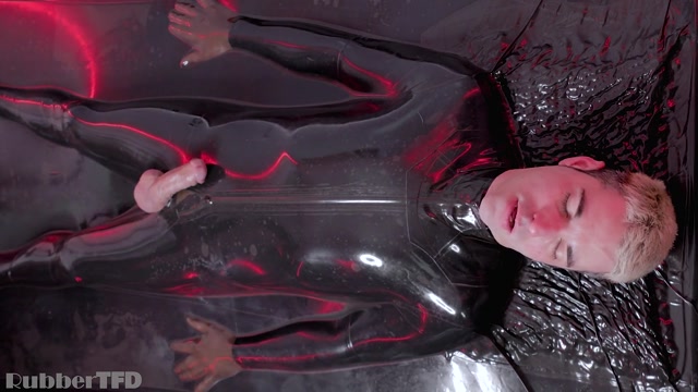 blond fetish stud in his rubber suit
