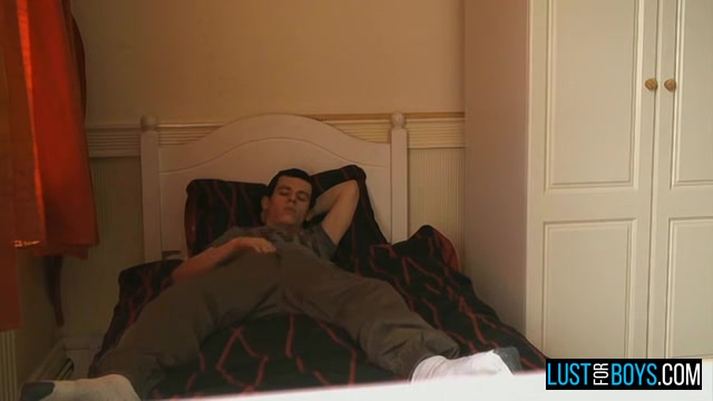Clothed Lad Rubs His Stiffening Crotch