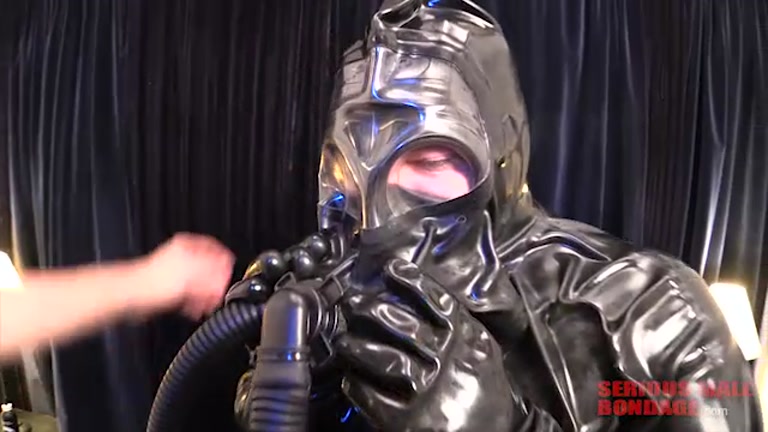 sub wrapped in rubber bondage suit