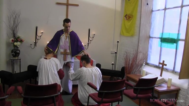 two choirboys play with the priest