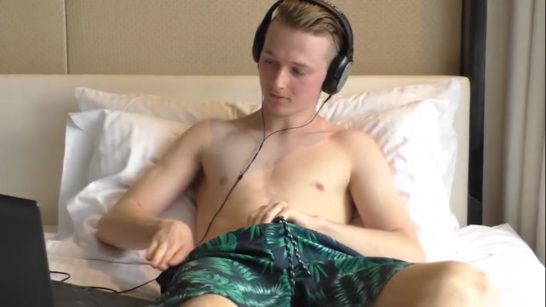 blond aussie pulls his hard cock out of his boxers