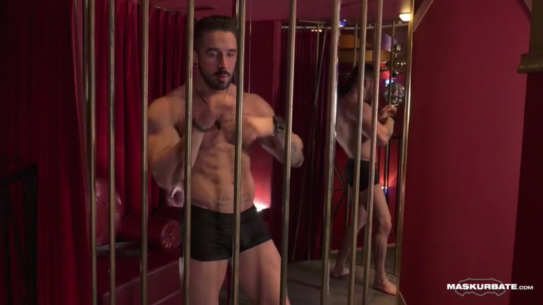 male stripper in a cage