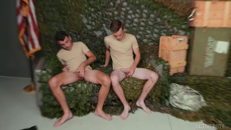 Army Buddies Sitting on Ammo Cases Stroking Their Dicks Before Anal Sex