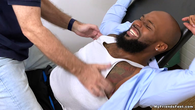 Black Man's Bare Feet Tickled with Electric Tooth Brush