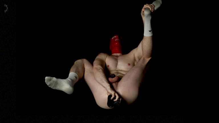 Man in Red Rubber Mask Stretches Pucker with Dildo