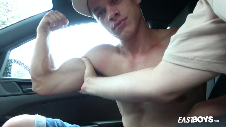 sexy hitchhiker flexes biceps in man's car