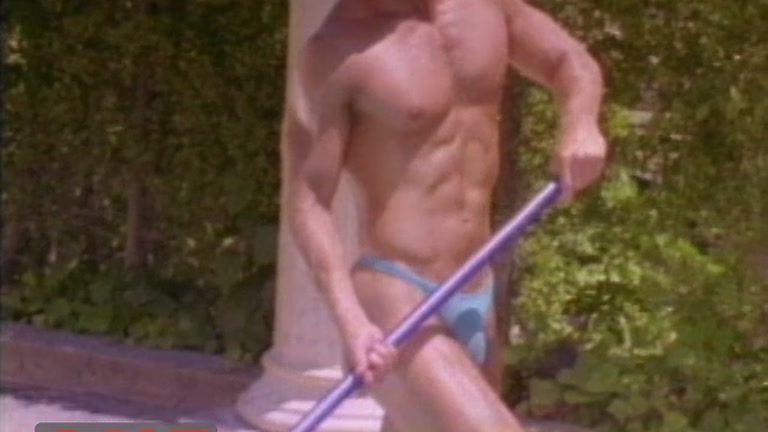 muscle hunk with beautiful body cleans a pool 