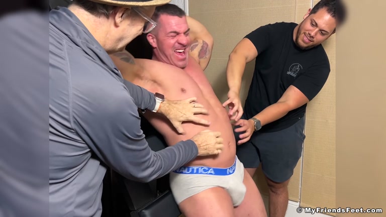 underwear hunk tied to a rach & tickled by two men