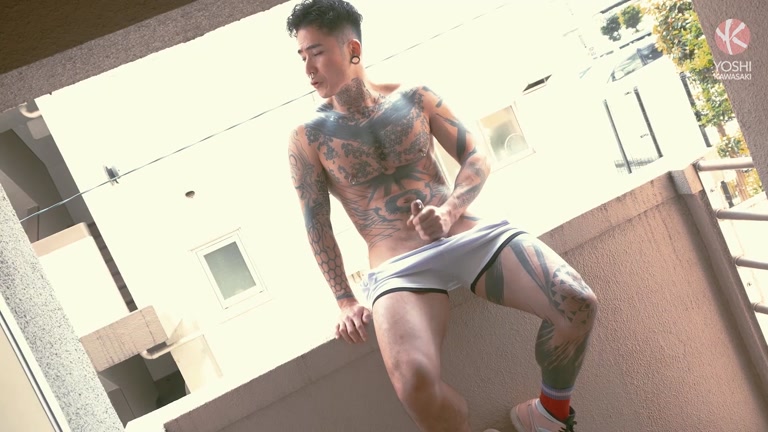 tattooed japanese stud jacks off sitting in his window