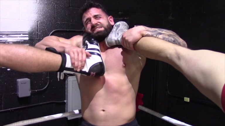 two wrestlers gang up on bearded beefy stud