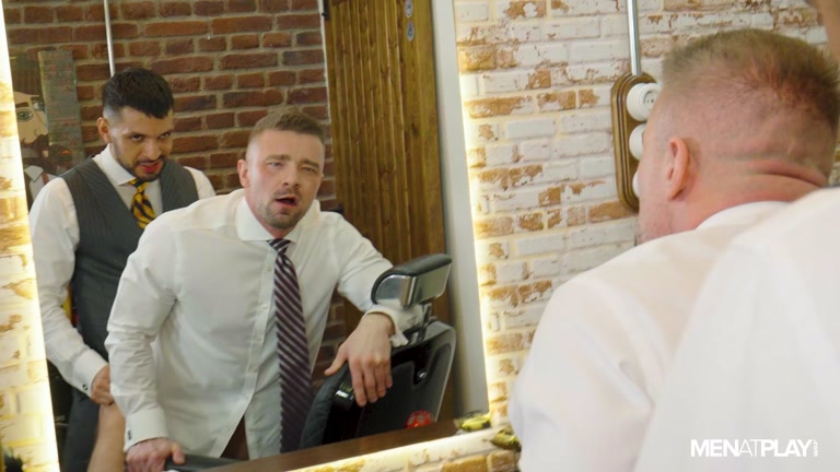 barber fucks his suited client in front of the shop's mirror