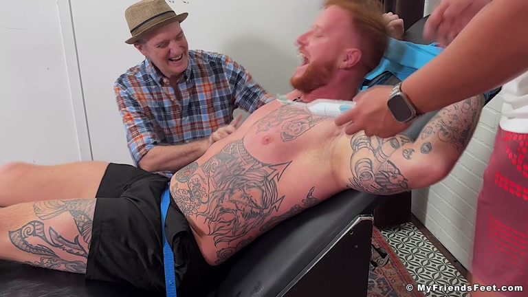 inked ginger man tickled by two men