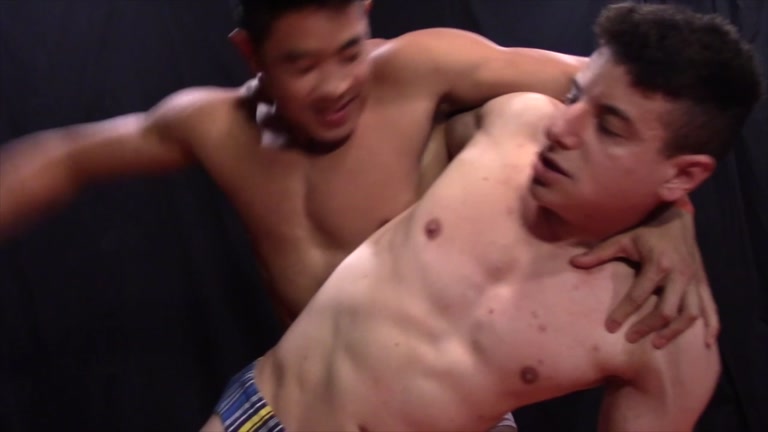 muscle boy executes some hot ball torture on his opponent