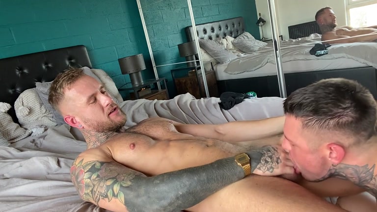 heavily inked man gets his dick sucked & his hole filled by younger guy