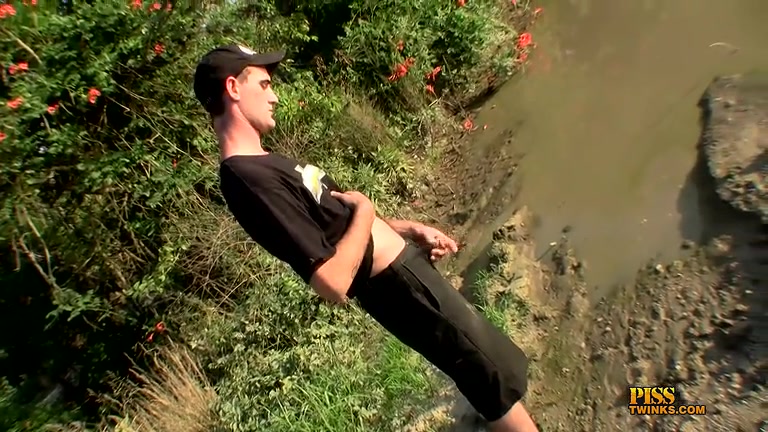 Lanky Guy with Treasure Trail Pisses Outdoors