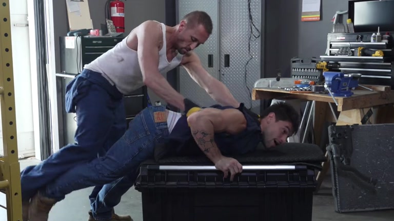 Muscle Hunk Overpowers Bratty Coworker & Fucks Him in the Shop