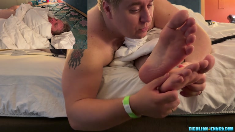 Man Wrapped in a Black Gets Bare Feet Tickled