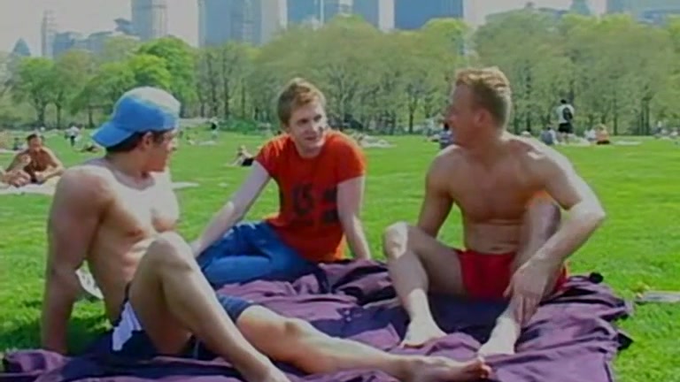 Blond Jock Rubs Oil into Stud's Bare Feet in Public Park