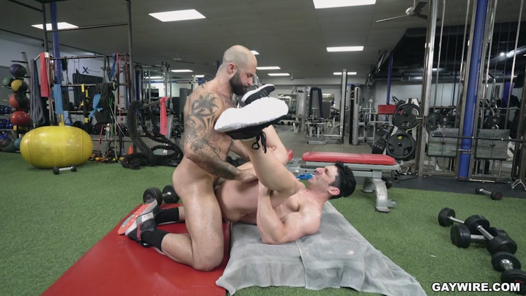 Hairy Hunk Pulls Out His Cock While Spotting Bench Presser in Gym