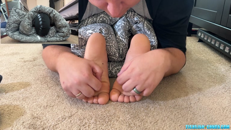 Wrapped in Blanket, Man Gets Bare Feet Tickled