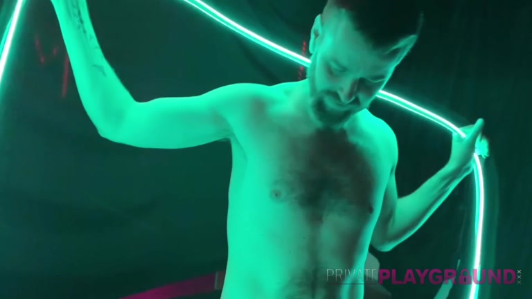 Naked Stud Dances with Neon Lights