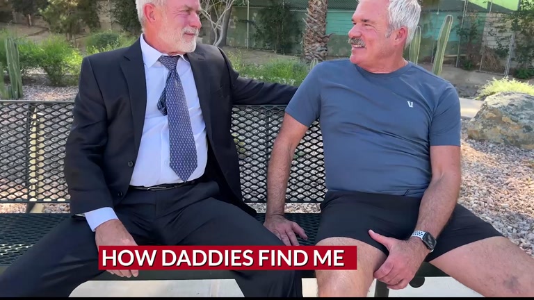 Handsome Businessman Resting on Bench Park Catches Older Jogger's Attention